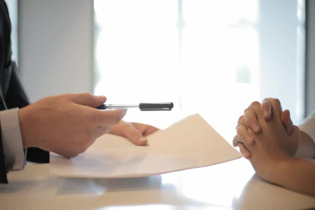 https://www.pexels.com/photo/crop-businessman-giving-contract-to-woman-to-sign-3760067/